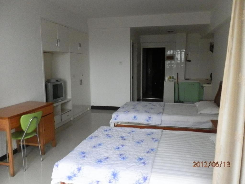 Xingfu Hotel Nanning Camera foto